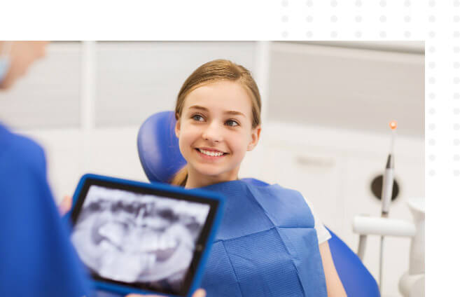 smiling dental client listening to dentist explaining