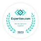 A circular badge with laurel leaves, the text "Expertise.com" and "Best Dog Trainers in Longmont" in the center, and "2023" at the bottom.
