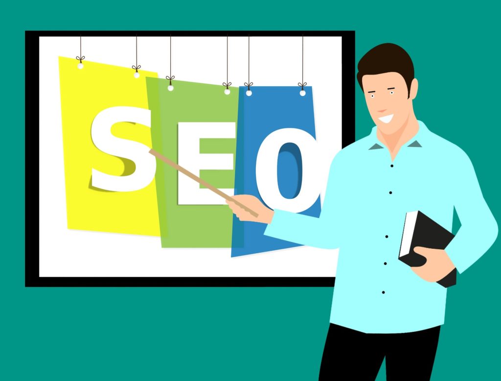graphic of a man pointing on a screen with SEO written on it