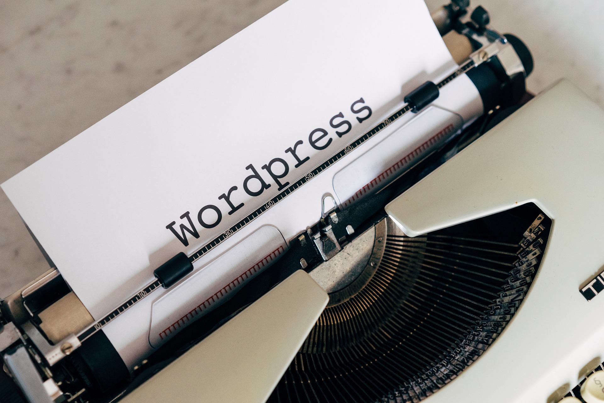 Mechanical typewriter typed WordPress on a blank paper