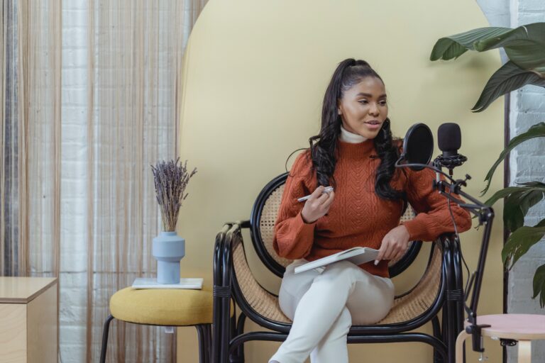 woman recording audio podcast | Epidemic Marketing Woman recording audio podcast